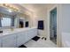 Double vanity bathroom with marble flooring, and access to the bedroom at 5724 S Bahama W Cir, Aurora, CO 80015