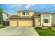 Two-story house with a three car garage and fountain at 5724 S Bahama W Cir, Aurora, CO 80015
