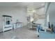 Open concept dining room with hardwood floors and staircase at 5724 S Bahama W Cir, Aurora, CO 80015
