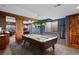 Finished basement recreation room with pool table and wet bar at 8796 E 150Th Ct, Thornton, CO 80602