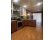Modern kitchen with stainless steel appliances and hardwood floors at 1515 S Monaco Pkwy, Denver, CO 80224