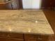 Close up view of kitchen island with granite countertop and wooden cabinets at 1515 S Monaco Pkwy, Denver, CO 80224