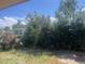 View of backyard with firepit and partial view of neighboring property at 1515 S Monaco Pkwy, Denver, CO 80224