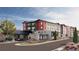 Attractive three-story building with inviting landscaping and ample parking at 12983 W Ida Ave # 306, Littleton, CO 80127