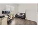 Bright home office features a desk, comfortable couch, and large windows at 5980 Sima Cir, Lone Tree, CO 80124