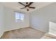 Spacious bedroom featuring neutral walls, carpet flooring, and a window with blinds at 10217 Greenfield Cir, Parker, CO 80134