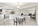 Modern kitchen with white cabinets and a breakfast bar at 1216 Ursula St, Aurora, CO 80011