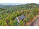 House with deck and mountain view at 6763 Deer Path, Evergreen, CO 80439
