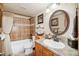 Clean bathroom with tub, shower, and updated vanity at 6763 Deer Path, Evergreen, CO 80439