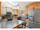 Spacious kitchen featuring modern appliances and ample cabinetry at 6763 Deer Path, Evergreen, CO 80439