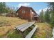 Rustic wooden picnic table in backyard at 6763 Deer Path, Evergreen, CO 80439
