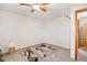 Spacious bedroom with ceiling fan and ample closet space at 6763 Deer Path, Evergreen, CO 80439