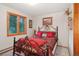 Cozy bedroom with a comfortable bed and plenty of natural light at 6763 Deer Path, Evergreen, CO 80439
