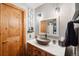 Updated bathroom with vessel sink and wooden vanity at 6763 Deer Path, Evergreen, CO 80439