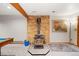 Basement features a wood burning stove and brick wall at 6763 Deer Path, Evergreen, CO 80439