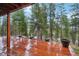 Deck overlooking wooded mountain view at 6763 Deer Path, Evergreen, CO 80439