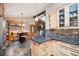 Kitchen with breakfast nook and view into the living room at 6763 Deer Path, Evergreen, CO 80439