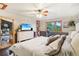 Main bedroom with hardwood floors, large windows, and views of backyard at 6763 Deer Path, Evergreen, CO 80439