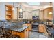 Modern kitchen with an island and stainless steel appliances at 6763 Deer Path, Evergreen, CO 80439