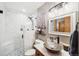 Spa-like bathroom with a walk-in shower and floating vanity at 6763 Deer Path, Evergreen, CO 80439