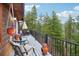 Deck with mountain views and outdoor seating area at 6763 Deer Path, Evergreen, CO 80439