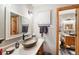 Elegant bathroom with vessel sink, modern vanity, and a large mirror at 6763 Deer Path, Evergreen, CO 80439