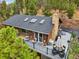 Large deck with seating area and mountain view at 6763 Deer Path, Evergreen, CO 80439