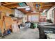Well-lit garage with ample storage and workbench at 6763 Deer Path, Evergreen, CO 80439