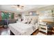 Large main bedroom with hardwood floors and ceiling fan at 6763 Deer Path, Evergreen, CO 80439