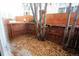 Private backyard with wooden fence and autumn leaves at 1050 S Monaco Pkwy # 88, Denver, CO 80224