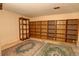 Finished basement with extensive built-in shelving at 1050 S Monaco Pkwy # 88, Denver, CO 80224