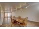 Spacious dining area with hardwood floors and view into living room at 1050 S Monaco Pkwy # 88, Denver, CO 80224