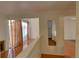 View of interior hallway with wooden floors and mirror at 1050 S Monaco Pkwy # 88, Denver, CO 80224