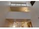 High-ceiling interior with loft area and track lighting at 1050 S Monaco Pkwy # 88, Denver, CO 80224