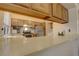 Kitchen features wood cabinets, stainless steel appliances, and a breakfast bar at 1050 S Monaco Pkwy # 88, Denver, CO 80224