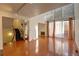 Spacious living room with hardwood floors and large windows at 1050 S Monaco Pkwy # 88, Denver, CO 80224