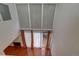 High-ceilinged living room with hardwood floors and sliding glass doors leading to a patio at 1050 S Monaco Pkwy # 88, Denver, CO 80224
