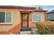 Home's front entrance with security system at 2862 N Monroe St, Denver, CO 80205