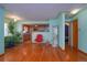 Living room with hardwood floors and view of kitchen at 2862 N Monroe St, Denver, CO 80205