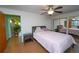 Bright bedroom with mirrored closet doors and ceiling fan at 2862 N Monroe St, Denver, CO 80205