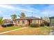 Brick ranch home with a well-manicured lawn at 2862 N Monroe St, Denver, CO 80205