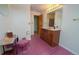 Bathroom with pink tile, a vanity, and toilet at 2862 N Monroe St, Denver, CO 80205