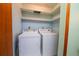 Laundry room with washer, dryer, and built-in shelving at 2862 N Monroe St, Denver, CO 80205