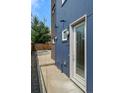 Rear exterior view showing private entrance and paved walkway at 3425 W 16Th Ave, Denver, CO 80204