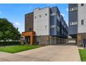 Modern three-story townhome with attached garage and well-maintained landscaping at 3425 W 16Th Ave, Denver, CO 80204