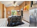 Dining area with wood table and chairs near the kitchen at 17305 E Wagontrail Pkwy, Aurora, CO 80015