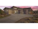 Modern home with a two-car garage and landscaped front yard at 11364 Birolli Pl, Littleton, CO 80125