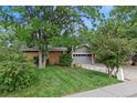 Ranch home with a large front yard and mature trees at 1746 Shavano St, Longmont, CO 80504