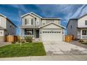 Two-story house with landscaped yard and attached garage at 27431 E 10Th Dr, Aurora, CO 80018