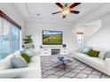 Bright living room with two sofas and a large TV at 4572 Walden Way, Denver, CO 80249